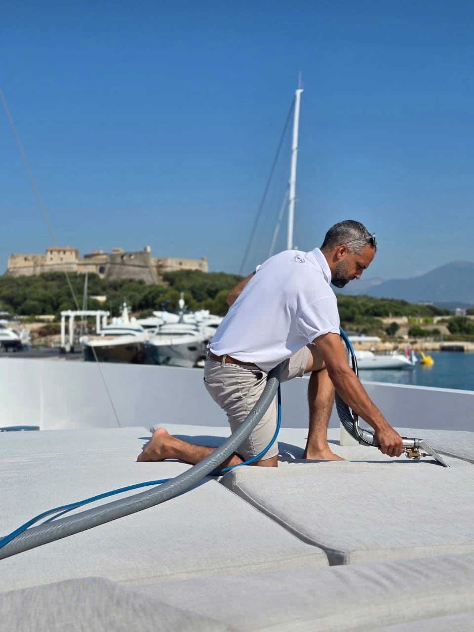 Carpet Care crew cleaning a yacht in Nice
